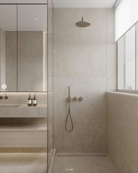 Stone shower interior with linear drain
