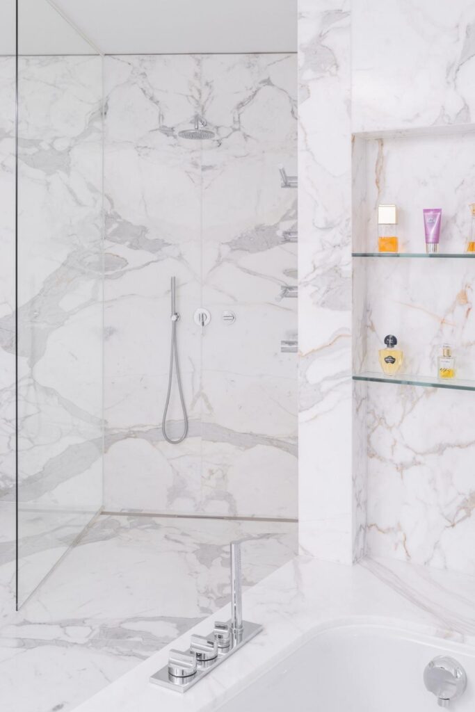 Hotel bath with clean lines and thoughtful shower layout