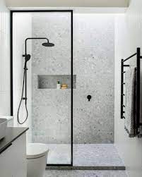 Compact bathroom with tiled shower and glass