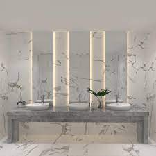 Dark tiled shower with frameless glass and niche